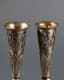 A PAIR OF RUSSIAN SILVER-GILT CHAMPAGNE FLUTES DECORATED WITH A MOTIF OF DANCING MUSES HOLDING HARPS
Maker’s mark of Alexander Mukhin on one and PAM on the second, 19th century