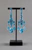 BLUE TOPAZ AND 18K WHITE GOLD GIRANDOLE EARRINGS AND RING