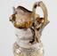 Silver jug decorated with heart
ornament