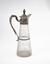 Neoclassical style silver-gilt and carved crystal decanter with dolphin-shaped handle
Europe, middle-center half of 19th century.