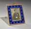A FINE BELLE EPOQUE FABERGE BLUE GUILLOCHÉ ENAMEL AND 14K GOLD PHOTOGRAPH FRAME
The House of Faberg, Supplier to the Court of His Imperial Majesty, Workmaster Michael Perchin, Russia, end of XIX century.