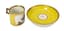 PORCELAIN CUP AND SAUCER YELLOW AND GILT PATTERN REPRESENTING RIDER