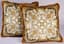 VERSACE PAIR OF BLACK AND GOLD BAROQUE VELVET CUSHIONS