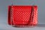 CHANEL RED CAVIAR LEATHER CLASSIC FLAP BAG
Red caviar-grained leather bag with double flap, CC logo clasp and double handle