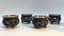 SET OF FOUR SILVER FILIGREE AND POLYCHROME ENAMEL SALT CELLARS