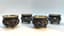 SET OF FOUR SILVER FILIGREE AND POLYCHROME ENAMEL SALT CELLARS