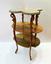 EMILE GALLE (1846-1904)
Sculpted walnut Sellette decorated with exotic wood marquetry