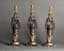SET OF THREE EMPIRE STYLE GILT BRONZE AND PATINATED CANDLESTICKS
Paris, vers 1860