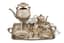 FABERGÉ SILVER TEA AND COFFEE SERVICE, 8 pieces
The House of Fabergé, Supplier to the Court of His Imperial Majesty, workmaster Stephen Wakeva, Russia, St Petersburg, 1880-1890