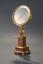 GILDED BRONZE FRAMED MIRROR SET ON
MARBLE COLUMN WITH SQUARE BASE
The mirror is held by a kneeling gilded figure