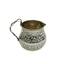 Silver creamer decorated with floral ornaments with a curled handle.
Master K. G. Simonsson, Russia, Saint Petersburg, 1857
(during the reign of Alexander II)
