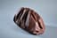 BOTTEGA VENETA
Brown leather pouch