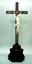 18TH CENTURY CRUCIFIX: A CARVED IVORY FIGURE OF CHRIST ON A CROSS INLAID WITH MOSAIC WOOD VENEER AND IVORY RESTING ON A TORTOISE SHELL BASE MOLDED WITH GUILLOCHET