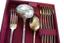 SILVER CUTLERY SET ENGLISH STYLE, 19TH CENTURY
Full cutlery set for 12 persons comprising: ladle, large serving fork, large serving spoon, 12 dinner forks, 12 dinner knives, 12 dinner spoons, 12 dessert forks, 12 dessert knives, 12 dessert spoons, 12 tea spoons, 12 coffee spoons