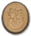 SILVER AND LAVA STONE CAMEO BROOCH