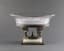 LARGE PAIRPOINT CENTREPIECE IN SILVER-PLATED METAL AND CRYSTAL ON A PEDESTAL DECORATED WITH FOUR CHERUBS AND WHITE ONYX BASE