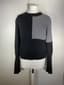CHANEL
Pull en cachemire noir et gris