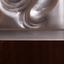 LALIQUE THREE-LEAF WOODEN FOLDING SCREEN WITH COLOURLESS CRYSTAL PANELS