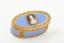 OVAL ENAMEL AND GOLD SNUFF BOX, WITH CENTRAL MEDALLION