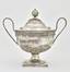 A silver sugar bowl with a lid and two fine handles decorated with floral ornament