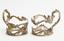 [mark of Faberge] A pair of openwork cup holders with a floral motif in the shape of intertwined acanthus leaves
Russia, Moscow, The House of Fabergé, Supplier to the Court of His Imperial Majesty, 1899-1908
