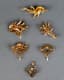 A COLLECTION OF FIVE VINTAGE GOLD BROCHES AND ONE GOLD PENDANT